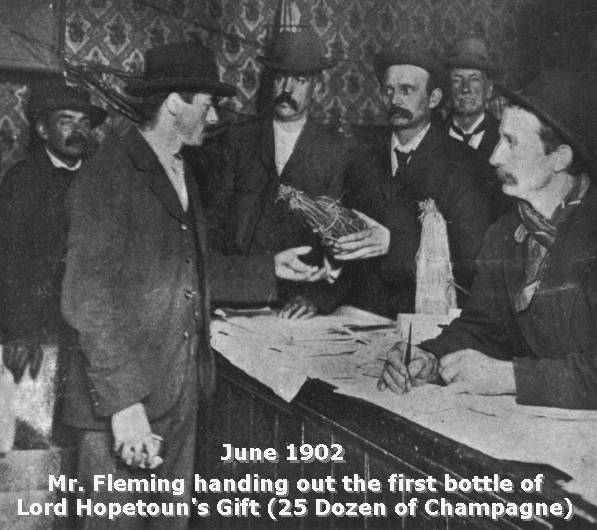 Photo of Fleming distributing Champagne
