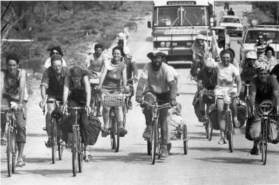 Photo: cyclists arriving at the gates to Roxby