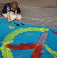 A toddler and her doll sends a message for peace